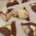 Chocolate and vanilla cheesecake hamantashen, triangular cookies